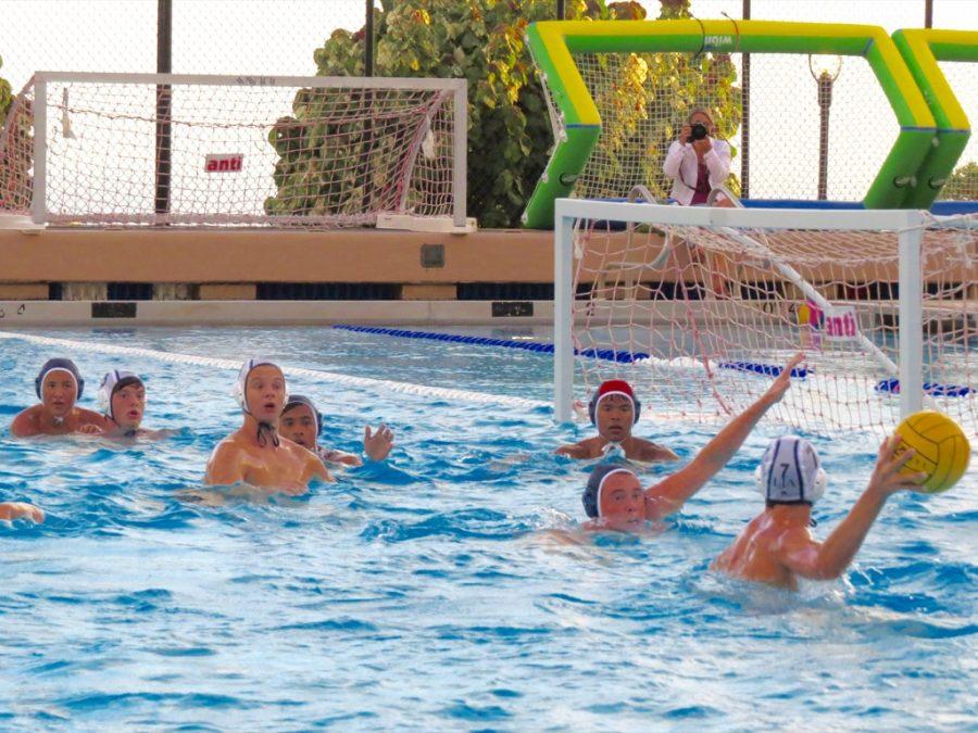 The boys Varsity II water polo team holds their ground against Le Jardins offense. 