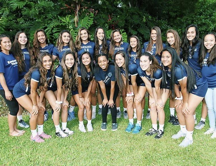 The Kamehameha Kapalama varsity volleyball girls pose for a picture