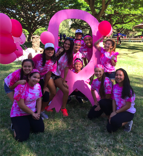 Student volunteers posed for group pictures after breaking down equipment at the Susan G. Komen race for a cure. 
