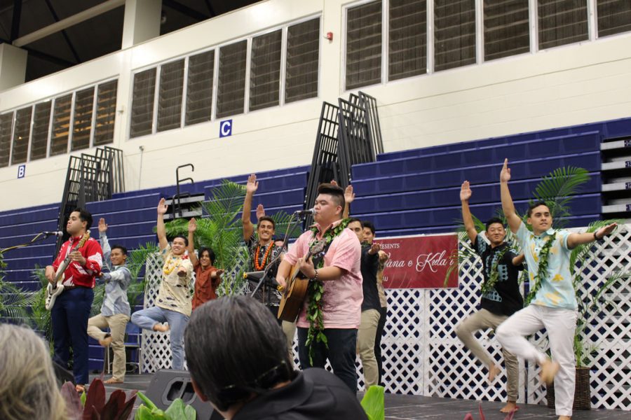 Class of 2018 students ʻElia Akaka and Kona Abergas were performing the song Nā Peʻa when members of the Hawaiian Ensemble jumped onstage to join them in dance.  Photo courtesy of Hamilton Keola.