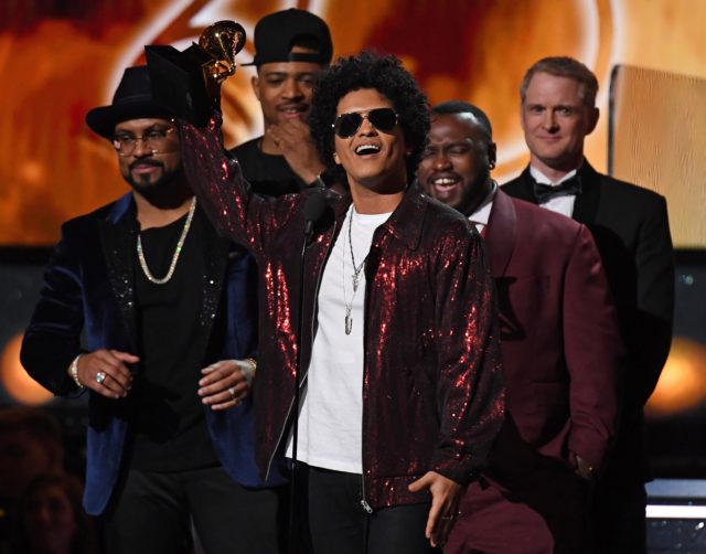 Bruno Mars receives his third Grammy for Album of the Year during the 60th Annual Grammy Awards show on January 28, 2018, in New York.  / AFP PHOTO / Timothy A. CLARY        