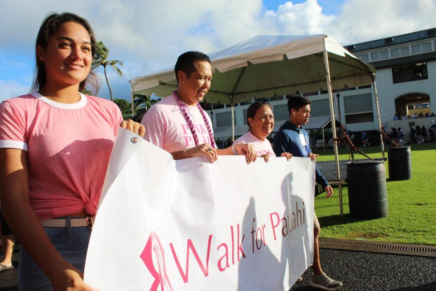 Poʻokula Dr. Taran Chun, leads the walk for Pauahi parade around Konia circle.