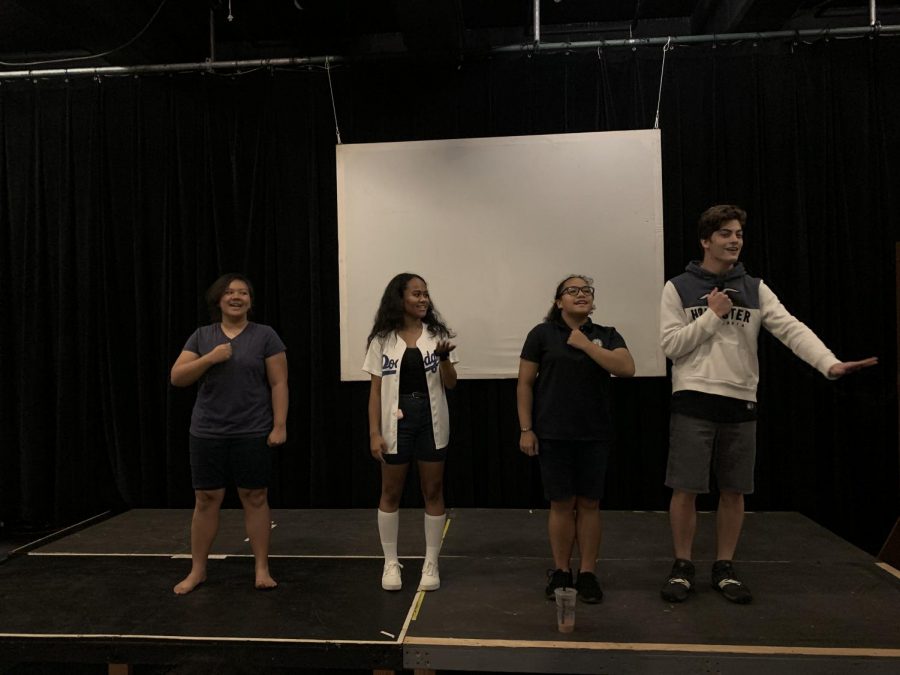 Theater students studying hard to recite their lines for the High School Musical play.