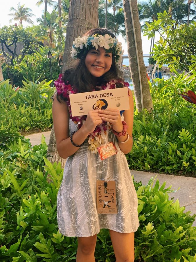 Adorned with lei, Tara DeSa showcases her commitment to UC Berkeley after the signing.