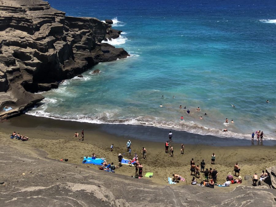 Tourists visit year-round to swim in the bright blue waters of Papakōlea Beach on Hawaii island.