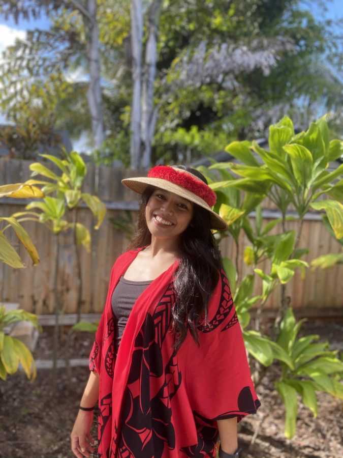 Tiare Cardejon posing with one of her kimonoʻs. 